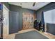 Bedroom with double doors, dresser, and window coverings at 9778 E Barley Rd, Florence, AZ 85132