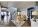 Spacious entryway with tiled flooring, a staircase, and views into the living and dining areas at 9778 E Barley Rd, Florence, AZ 85132