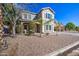 Two-story house with a landscaped front yard and stone driveway at 9778 E Barley Rd, Florence, AZ 85132