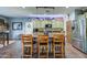 Rustic kitchen with an island, stainless steel appliances, and a farmhouse sink at 9778 E Barley Rd, Florence, AZ 85132