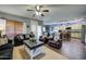 Spacious living room showcasing a cozy seating arrangement and views into the kitchen at 9778 E Barley Rd, Florence, AZ 85132