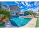 Luxury pool and patio with lounge chairs and outdoor kitchen at 9778 E Barley Rd, Florence, AZ 85132