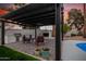 Outdoor patio with pergola, built-in grill, fireplace, and seating area at 980 Castillo E Dr, Litchfield Park, AZ 85340