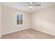 Spacious bedroom with plantation shutters and neutral walls at 980 Castillo E Dr, Litchfield Park, AZ 85340