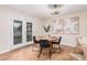 Charming dining area with a round table and modern chairs, near sliding doors to backyard at 980 Castillo E Dr, Litchfield Park, AZ 85340