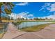 Scenic view of a golf course with a pond and walking bridge at 980 Castillo E Dr, Litchfield Park, AZ 85340