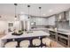 Updated kitchen featuring white cabinets, quartz countertops and stainless steel appliances at 980 Castillo E Dr, Litchfield Park, AZ 85340