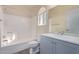 Clean bathroom with a gray vanity and bathtub at 10101 N 91St Ave # 136, Peoria, AZ 85345