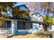 Light blue two-story house with a gray roof and landscaping at 10101 N 91St Ave # 136, Peoria, AZ 85345