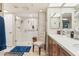 Well-lit bathroom featuring a glass-enclosed shower, vanity with double sinks, and neutral color scheme at 10206 N 105Th Way, Scottsdale, AZ 85258