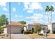 Exterior view of a well-maintained home with a tile roof and a two-car garage at 10206 N 105Th Way, Scottsdale, AZ 85258