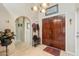 Inviting foyer with tile flooring and an arched doorway at 10206 N 105Th Way, Scottsdale, AZ 85258