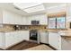 Well-lit kitchen features stainless steel appliances, stone countertops and bright cabinets at 10206 N 105Th Way, Scottsdale, AZ 85258