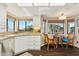 Well-lit eat-in kitchen featuring a garden window, stainless steel appliances, and hardwood flooring at 10206 N 105Th Way, Scottsdale, AZ 85258