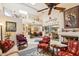 Spacious living room with a fireplace, skylight, and decor at 10206 N 105Th Way, Scottsdale, AZ 85258