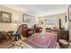 Bright living room with two recliner chairs and a large decorative rug at 10206 N 105Th Way, Scottsdale, AZ 85258