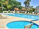 Community pool with ample lounge chairs and well-maintained surroundings at 10206 N 105Th Way, Scottsdale, AZ 85258