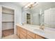 Double vanity bathroom with a large mirror and ample storage at 10410 N Cave Creek Rd # 2060, Phoenix, AZ 85020