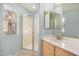 Clean bathroom with a shower, single vanity, and mirror at 10410 N Cave Creek Rd # 2060, Phoenix, AZ 85020