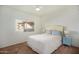 Well-lit bedroom with a queen-size bed, nightstand and large window at 10410 N Cave Creek Rd # 2060, Phoenix, AZ 85020