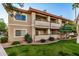 Tan two-story building with balconies and green lawn at 10410 N Cave Creek Rd # 2060, Phoenix, AZ 85020