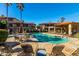 Community pool with ample lounge chairs at 10410 N Cave Creek Rd # 2060, Phoenix, AZ 85020