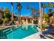 Relaxing community pool with patio furniture at 10410 N Cave Creek Rd # 2060, Phoenix, AZ 85020