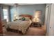 Spacious bedroom with a floral bedspread and ample closet space at 10646 W Boswell Blvd, Sun City, AZ 85373