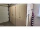 Garage with additional storage cabinets at 10646 W Boswell Blvd, Sun City, AZ 85373