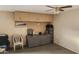 Garage workshop area with workbench and storage at 10646 W Boswell Blvd, Sun City, AZ 85373