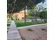 Pathway to community pool with trees and landscaping at 1126 W Elliot Rd # 1058, Chandler, AZ 85224