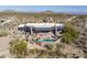 Aerial view of a luxury home with pool and desert landscape at 11501 E Mark Ln, Scottsdale, AZ 85262