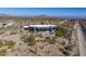 Aerial view of a modern home with a pool and desert landscape at 11501 E Mark Ln, Scottsdale, AZ 85262