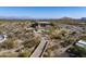 Aerial view of luxury home with private driveway and desert landscape at 11501 E Mark Ln, Scottsdale, AZ 85262