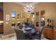 Charming breakfast nook with a view and elegant chandelier at 11501 E Mark Ln, Scottsdale, AZ 85262