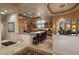 Spacious kitchen with granite island, wooden cabinetry, and views of the backyard at 11501 E Mark Ln, Scottsdale, AZ 85262