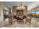 Elegant living room with ornate furniture, a large painting, and marble flooring at 11501 E Mark Ln, Scottsdale, AZ 85262