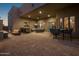 Spacious patio with seating, dining area, and bar at 11501 E Mark Ln, Scottsdale, AZ 85262