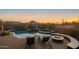 Backyard oasis with a freeform pool, spa, fire pit, and mountain views at 11501 E Mark Ln, Scottsdale, AZ 85262