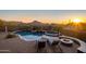 Backyard oasis with a freeform pool, spa, fire pit, and mountain views at 11501 E Mark Ln, Scottsdale, AZ 85262