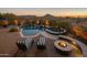 Luxury pool and spa with fire pit and lounge chairs at 11501 E Mark Ln, Scottsdale, AZ 85262