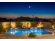 Stunning pool and spa area with mountain views at sunset at 11501 E Mark Ln, Scottsdale, AZ 85262