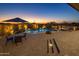 Relaxing pool area with patio furniture and sunset views at 11501 E Mark Ln, Scottsdale, AZ 85262