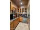 Wet bar with granite countertop and ample cabinet space at 11501 E Mark Ln, Scottsdale, AZ 85262