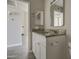 Bathroom with granite countertop and white cabinets at 11616 N 30Th Ln, Phoenix, AZ 85029