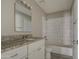 Bathroom with granite countertop and subway tile at 11616 N 30Th Ln, Phoenix, AZ 85029