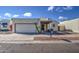 House exterior, featuring a single-car garage and walkway at 11616 N 30Th Ln, Phoenix, AZ 85029