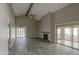 Spacious living room featuring high ceilings and a fireplace at 11616 N 30Th Ln, Phoenix, AZ 85029