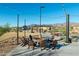 Relax by the fire pit with string lights in the community at 11971 E Chevelon Trl, Gold Canyon, AZ 85118