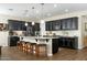 Modern kitchen with dark cabinetry and granite island at 11971 E Chevelon Trl, Gold Canyon, AZ 85118